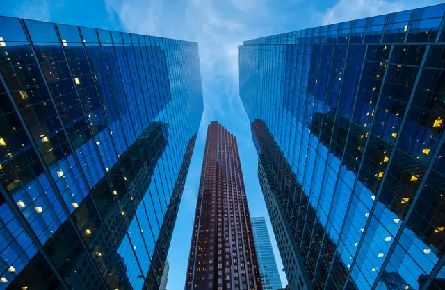 Banking and capital markets financial district representing risk and regulatory reporting modernization