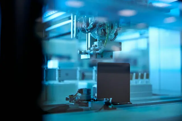 Automated manufacturing equipment on a production line representing ERP and operations modernization